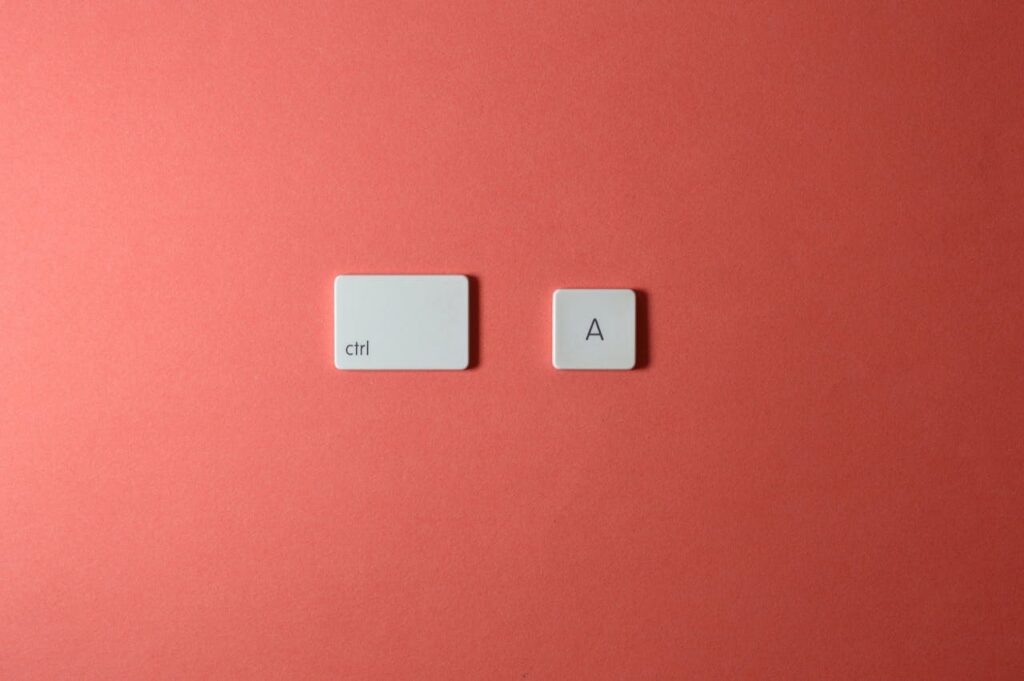White ctrl and A keys on a simple red background create a minimalist and modern look.